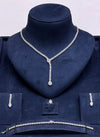 Full Luxury Bridal Set Displayed Symmetrically on Dark Navy Blue Velvet Neck Bust stand under Soft Studio Lighting