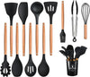 Comprehensive set of heat-resistant silicone spatulas, whisks, and tongs, designed for versatile professional cooking.