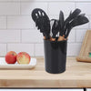Minimalist black kitchen tools set placed on a wooden countertop, perfect for modern Dubai apartment interiors.