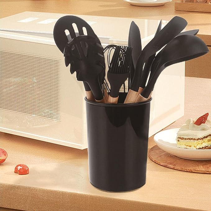 Aesthetic shot of the black silicone utensil holder next to a microwave, highlighting a tidy and organized kitchen space.