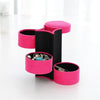 Three Layer Multi Tiered Circular Storage Columns Unrolled Vertically Showcasing Soft Black Velvet Interior Lined with Luxury Jewelry