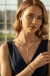 Side Angle Studio View of Elegant Model Showcasing the Matching Crystal Droplet Necklace and Tennis Bracelet Combo