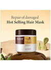 Isolated product view of the premium hair repair mask jar placed on a textured sand pedestal base display.