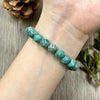 Real Life Modeling Close Up View Of Comfortable Unisex Turquoise Stone Bead Bracelet Worn Securely On Person Wrist