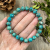 Natural Turquoise Stone Beaded Bracelet Displayed Open On A Person Hand To Showcase Unique Earthborn Marbling Matrix