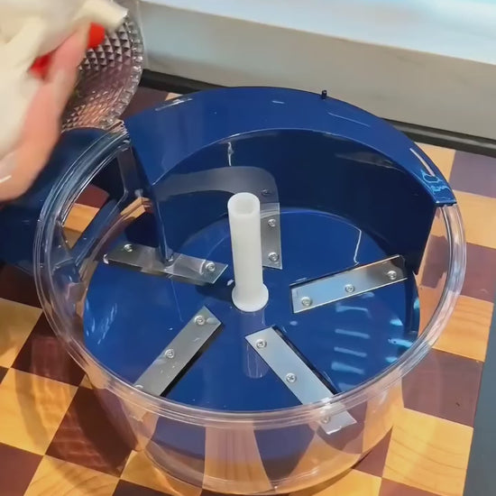 "A close-up demonstration of an automatic electric peeler efficiently peeling a grape in seconds, showing a mess-free and fast kitchen prep process."