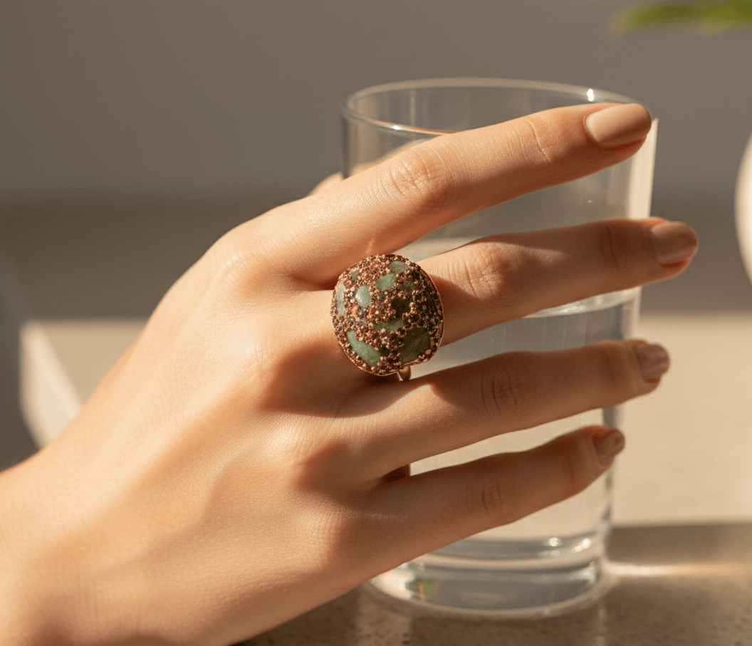 Zalviro Two Tone Crystal Dome Statement Ring in Rose Gold with Mint Green Pavé Stones Displayed on Hand